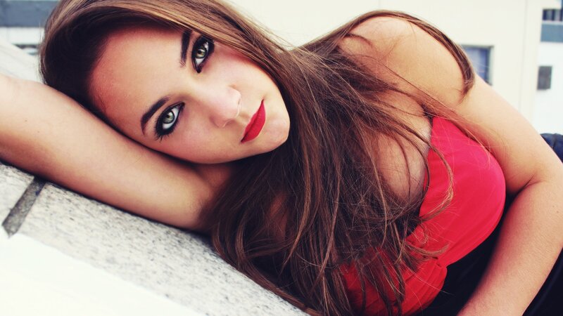 woman in red top resting
