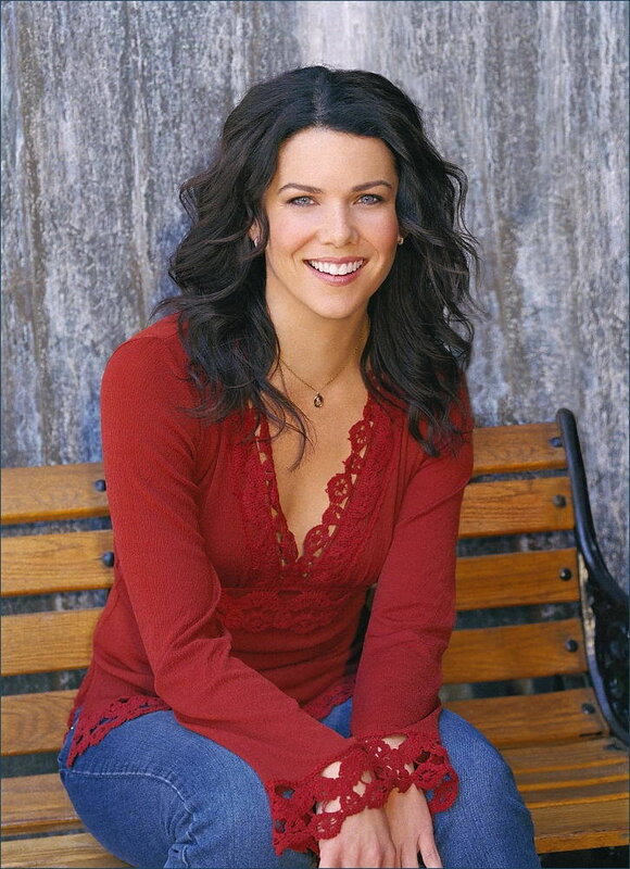 woman in red top sitting on bench
