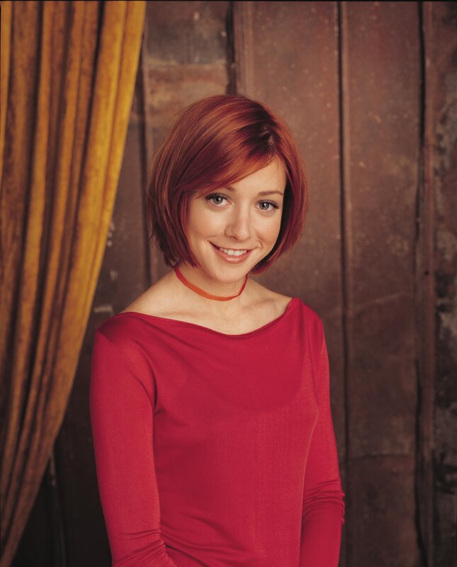 woman in red top smiling
