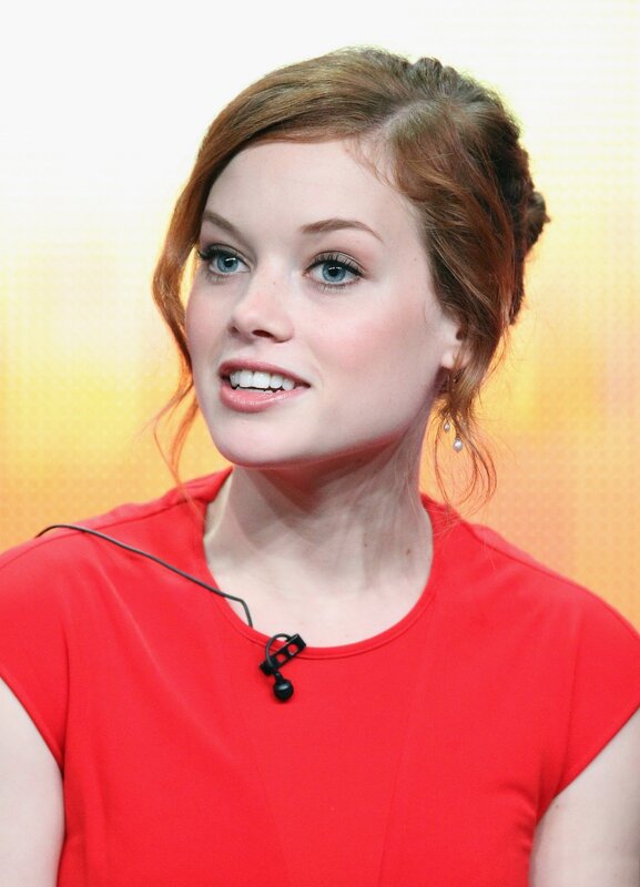 woman in red top smiling