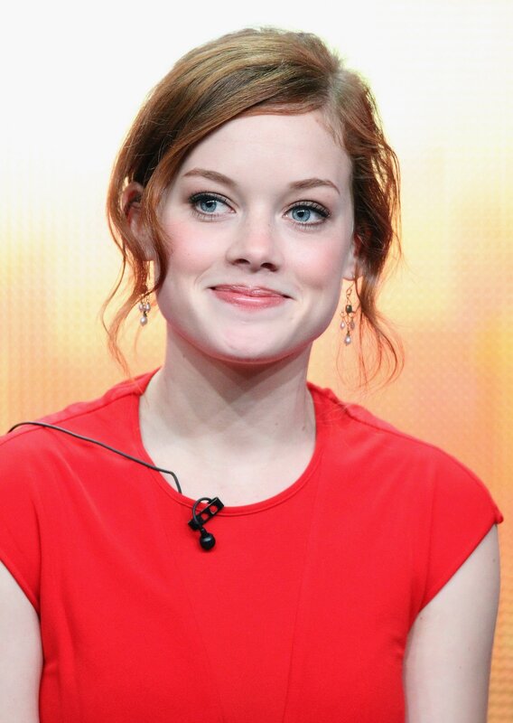 woman in red top smiling