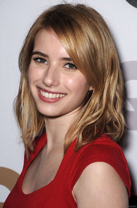 woman in red top smiling