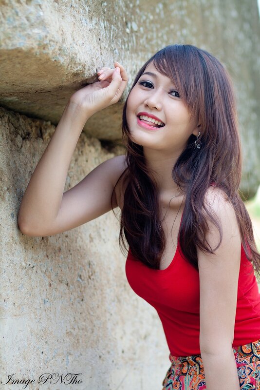 woman in red top smiling