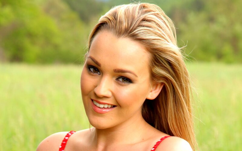 woman in red top smiling
