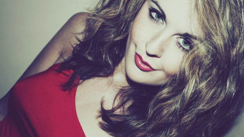 woman in red top smiling