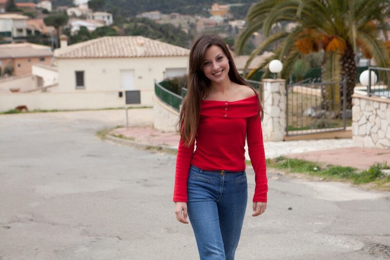 woman in red top walking