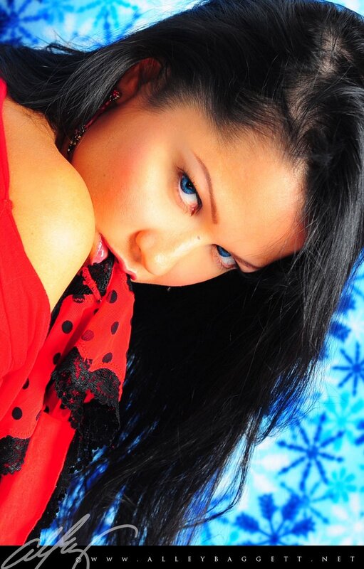woman in red top with blue eyes