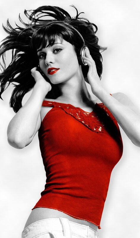woman in red top with headphones