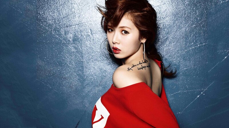 woman in red top with tattoo