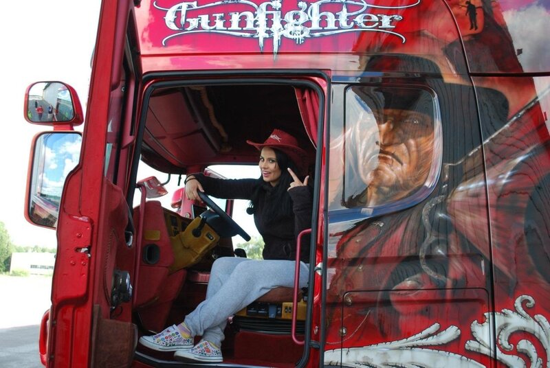 Woman in red truck cab