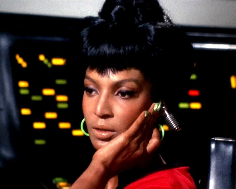 Woman in red uniform on starship
