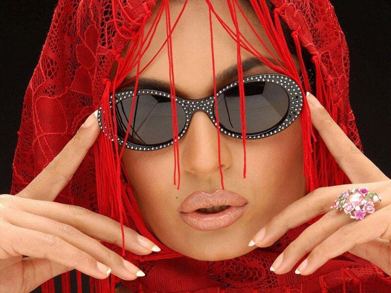 woman in red veil and sunglasses