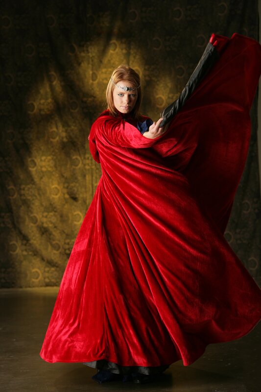 woman in red velvet cloak