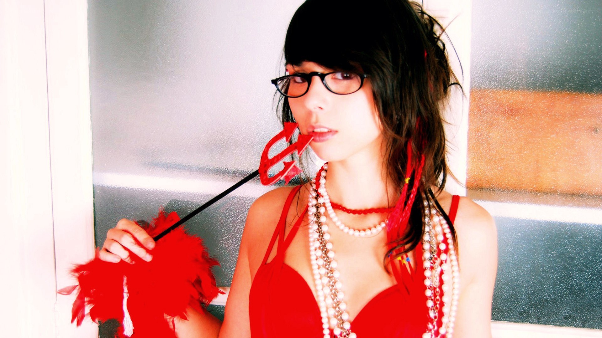 woman in red with devil's trident