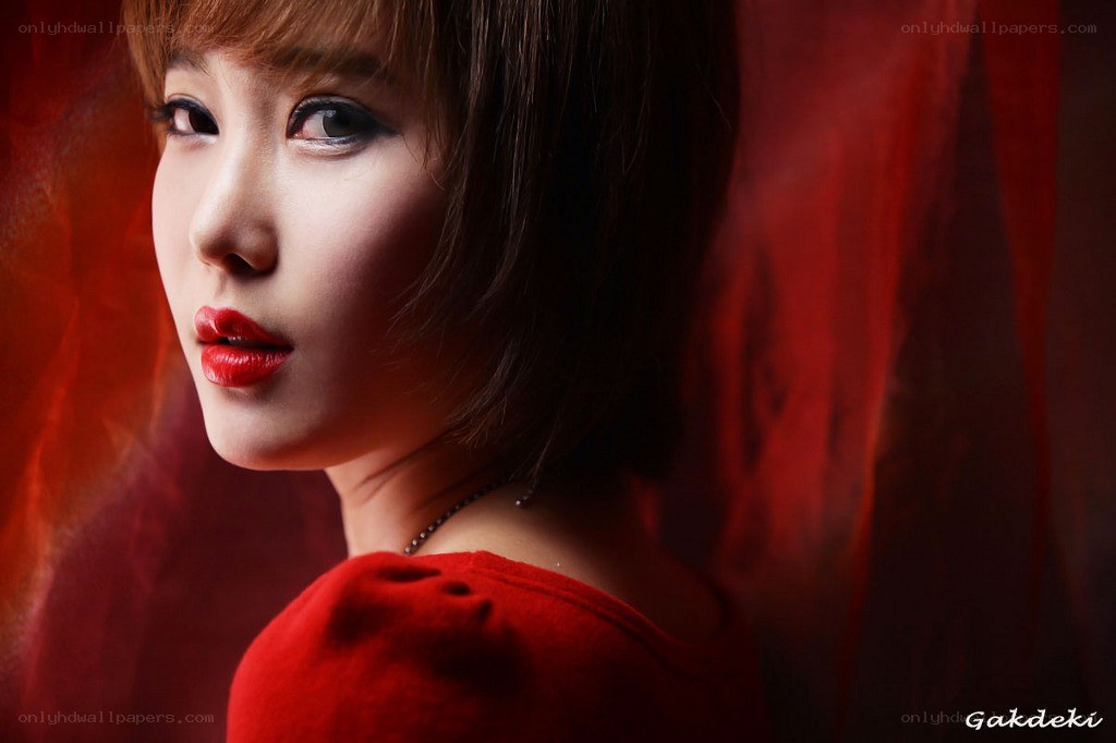 woman in red with dramatic lighting