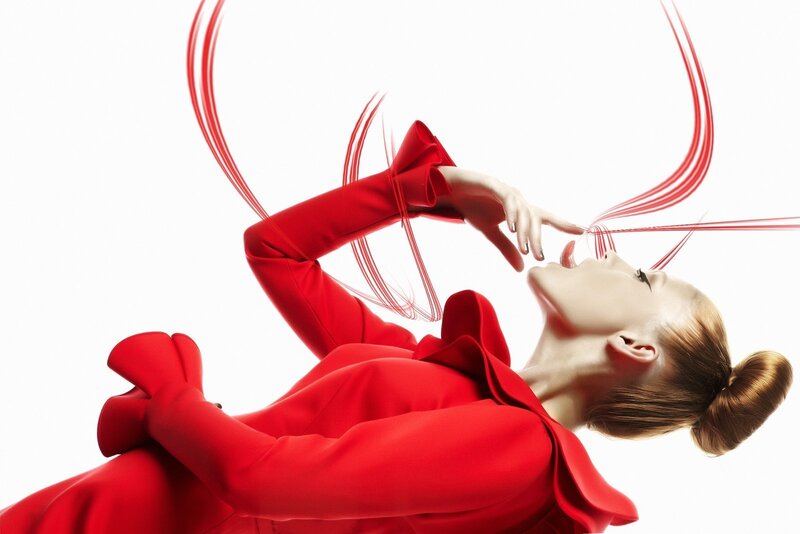 woman in red with flowing lines