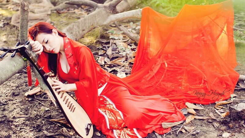 Woman in red with pipa