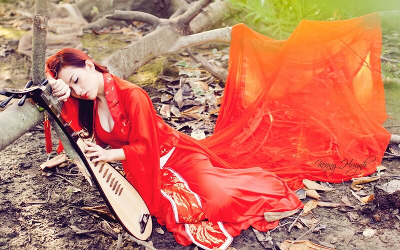 Woman in red with pipa