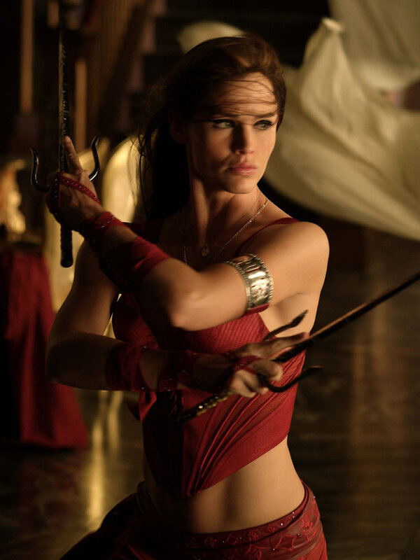 Woman in red with sai weapons