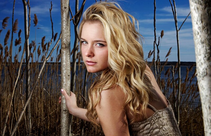 woman in reeds by water
