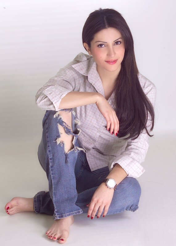 woman in ripped jeans sitting