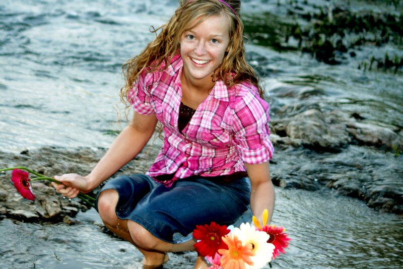 Woman in River with Flowers