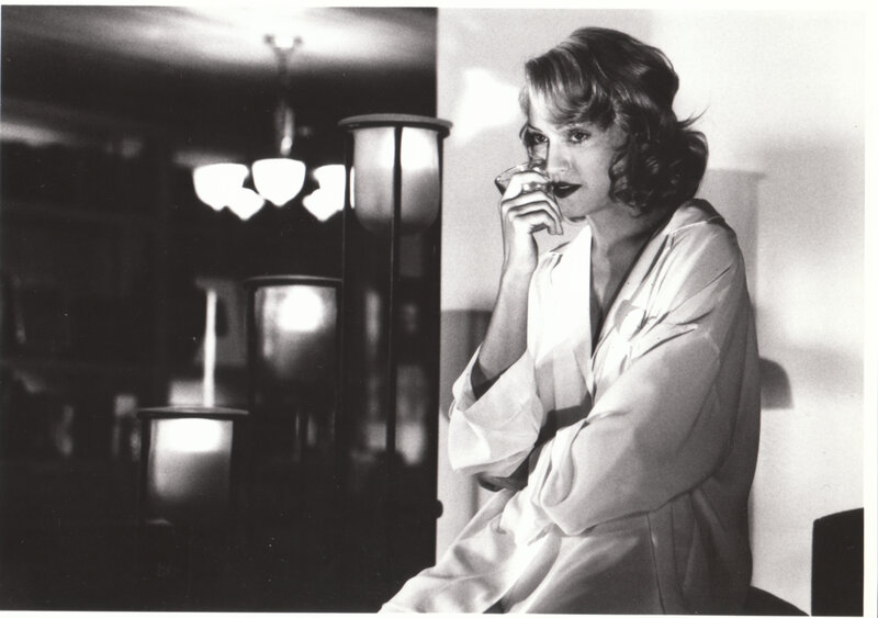 woman in robe drinking