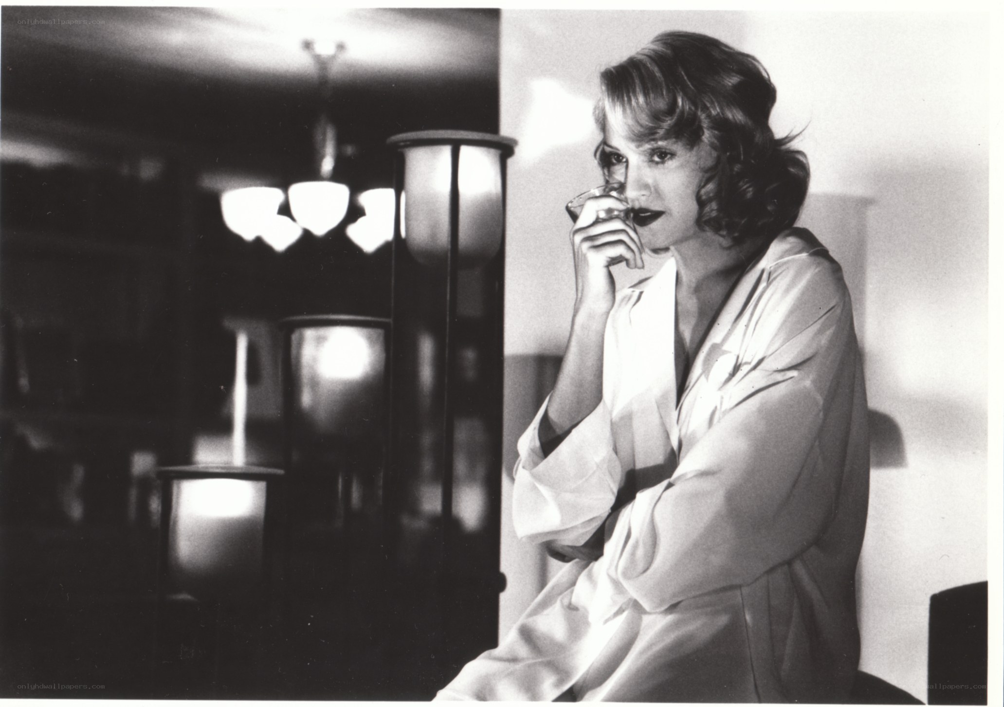 woman in robe drinking