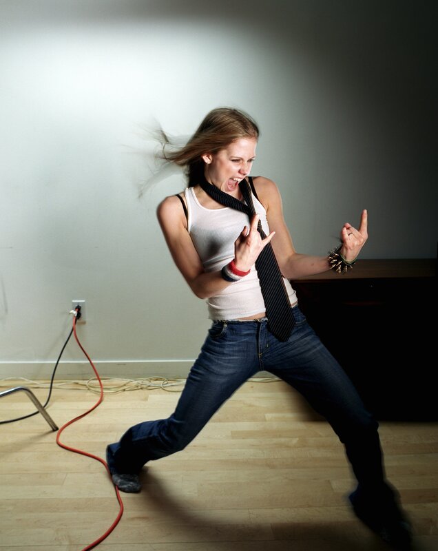 woman in rock pose with tie