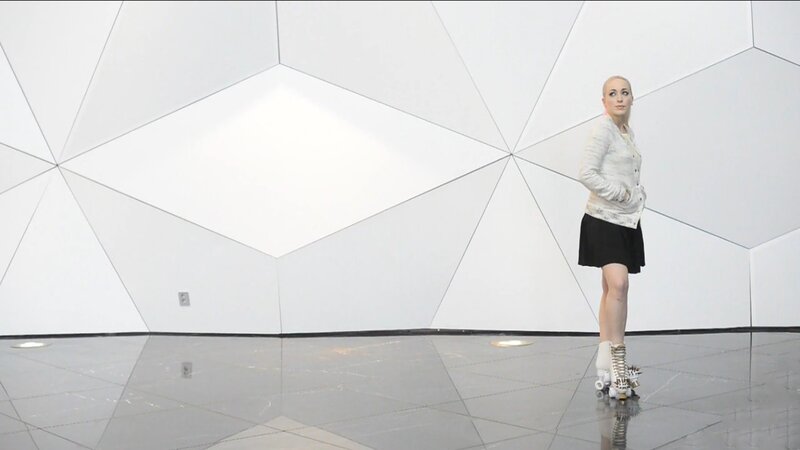 woman in roller skates on geometric floor