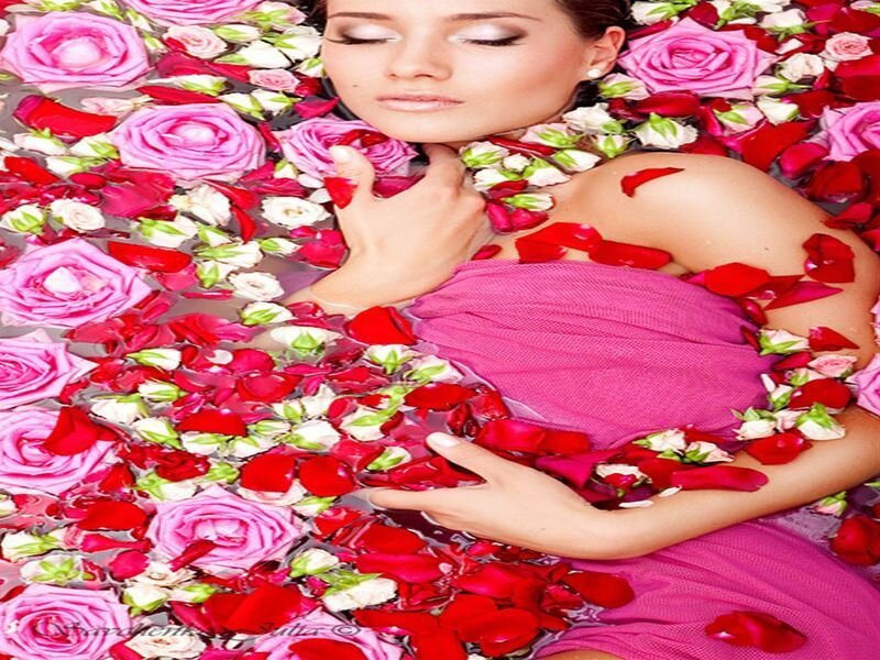 woman in rose petal bath