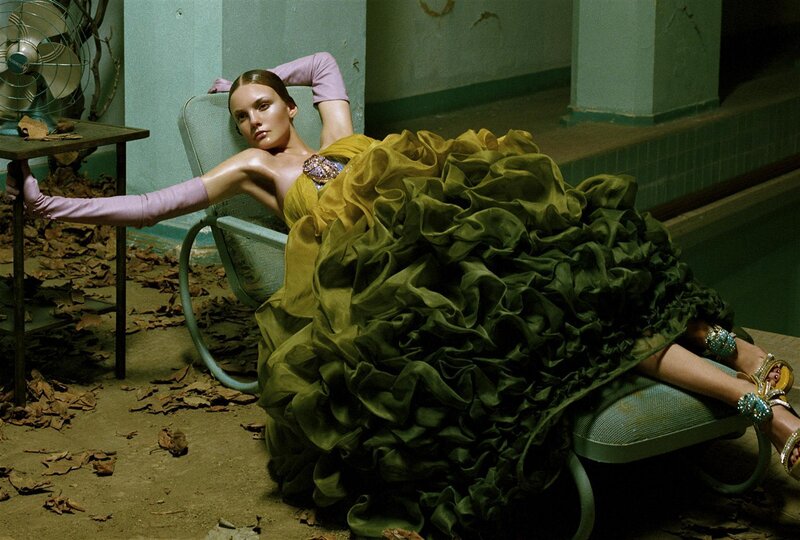 Woman in ruffled gown on lounge chair