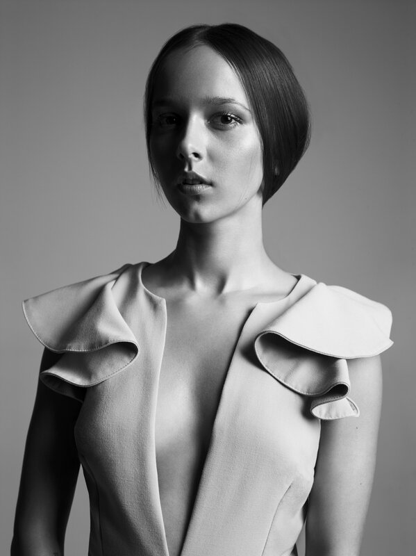Woman in Ruffled Top — Black, Dramatic, Photograph