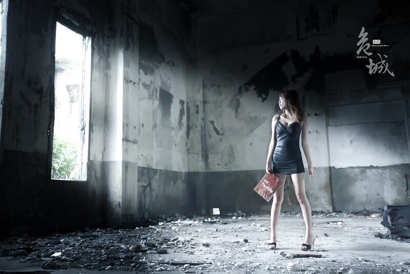 Woman in ruined building