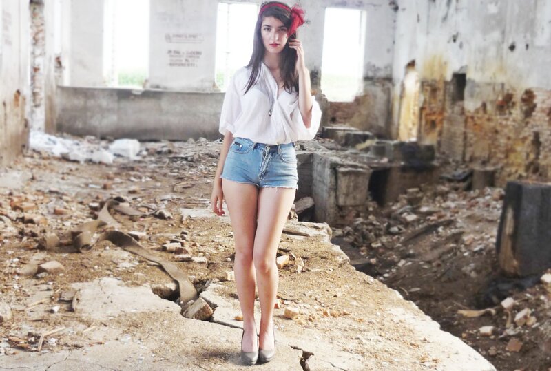 Woman in ruined building