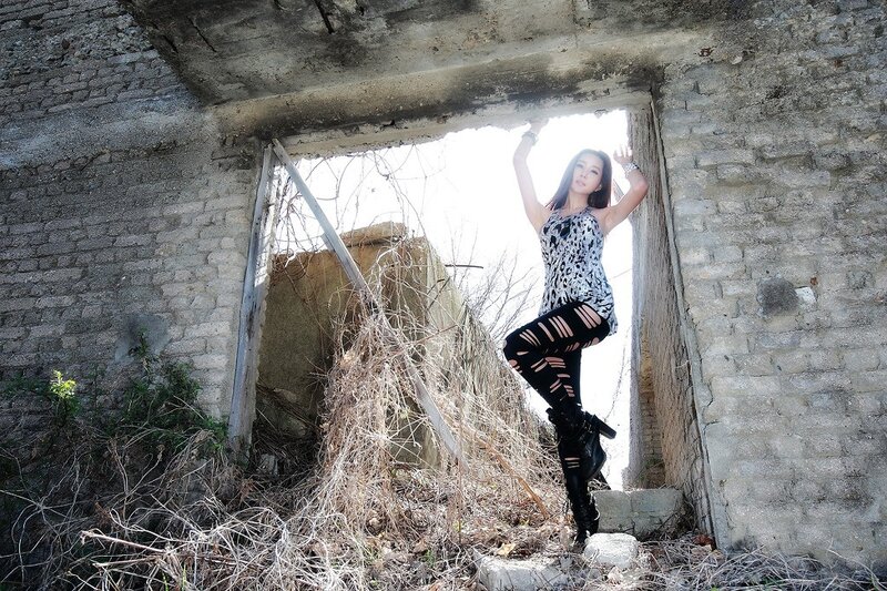 woman in ruined building
