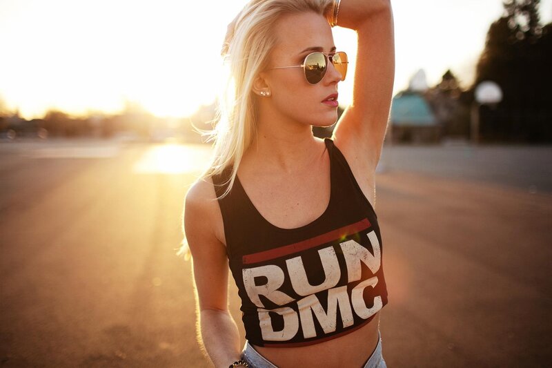 woman in run dmc tank top