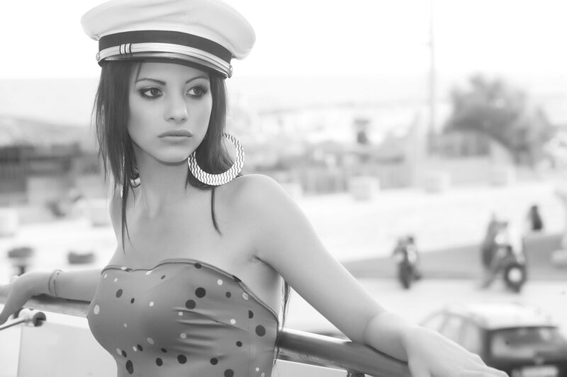 woman in sailor hat and polka dot dress