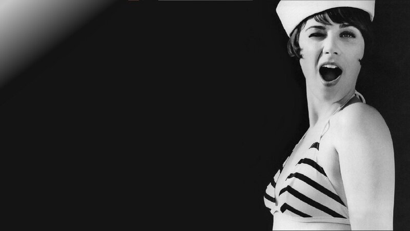 woman in sailor outfit singing