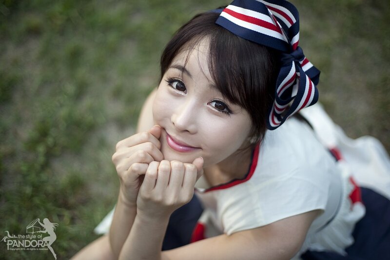 woman in sailor outfit smiling