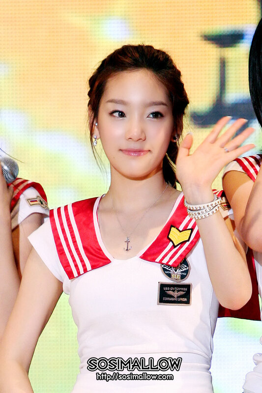 woman in sailor outfit waving