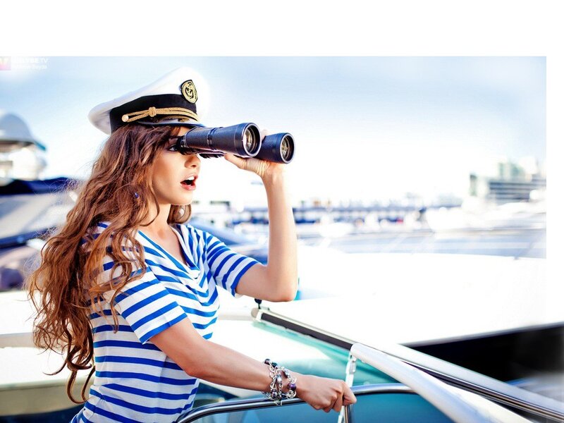 woman in sailor outfit with binoculars