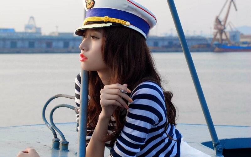 Woman in Sailor Uniform — Blue, Contemplative