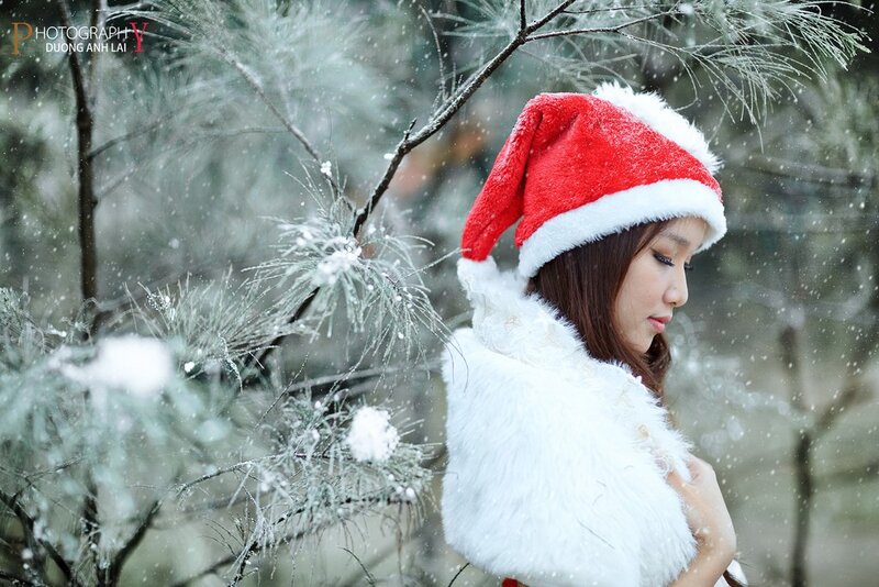 Woman in Santa hat in snow