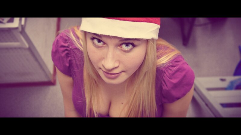 woman in santa hat looking up