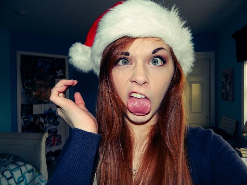 woman in santa hat making face