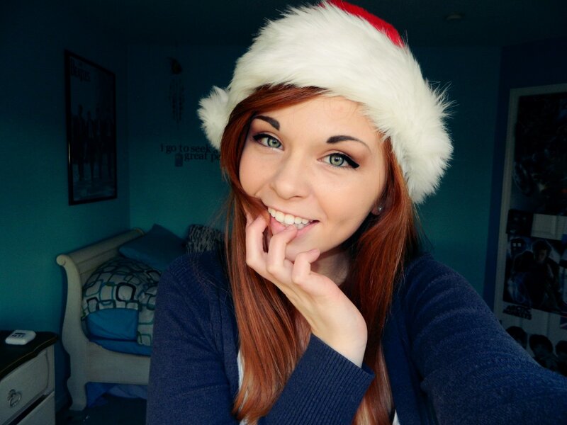 woman in santa hat smiling