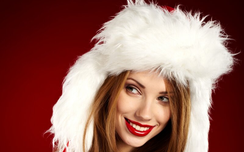 woman in santa hat smiling