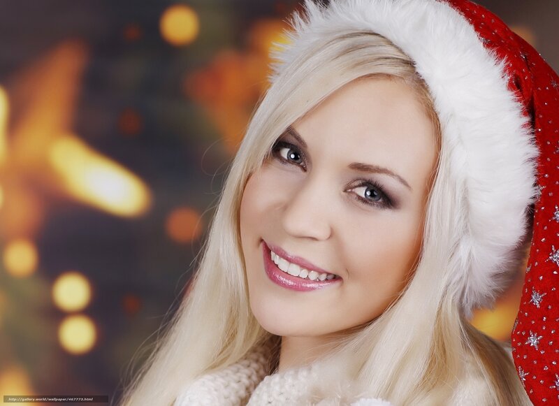 woman in santa hat smiling