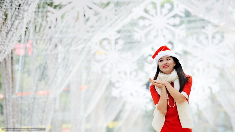 woman in santa hat smiling